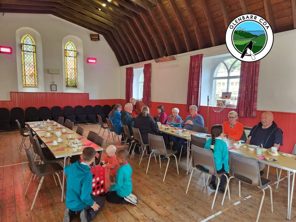 Residents of different ages meeting together in Glenbarr Hall