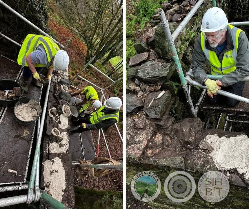 Specialist contractors repairing the stone walls of the Doocot